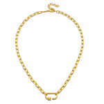 The New Beginnings Lotus Charm Holder Necklace on a display stand, showcasing its stylish gold chain and charm holder. This spiritual jewelry serves as a meaningful talisman for personal journeys, perfect for yogis and those exploring their spirituality through meditation.