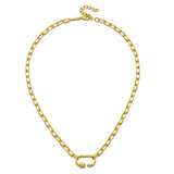 The New Beginnings Lotus Charm Holder Necklace on a display stand, showcasing its stylish gold chain and charm holder. This spiritual jewelry serves as a meaningful talisman for personal journeys, perfect for yogis and those exploring their spirituality through meditation.