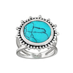 Nurture Your Voice Turquoise Silver Ring by Satya Jewelry features a stunning faceted turquoise stone with a beaded sterling silver design, symbolizing health and self-expression, ideal for spiritual jewelry enthusiasts interested in meditation and meaningful talismans.