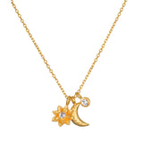 Spirit in Transformation Lotus Moon Necklace featuring a gold-plated lotus flower, crescent moon, and white topaz star. This piece of spiritual jewelry serves as a talisman for new beginnings and protection, perfect for yoga and meditation practices.