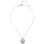 The Mother Moon Silver Locket Necklace displayed on a flat surface, highlighting its intricate design. This spiritual jewelry piece embodies the power of the moon and serves as a meaningful charm for meditation, protection, and nurturing one’s zodiac essence.