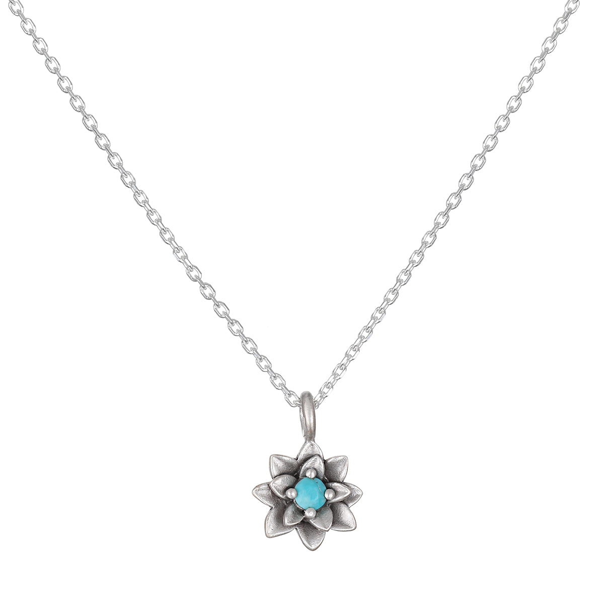 Soul Renewal Silver Lotus Necklace featuring a beautiful lotus flower pendant accented with a turquoise stone. This spiritual jewelry embodies the essence of meditation, serving as a meaningful talisman for those seeking to manifest new beginnings and embrace their full potential. Ideal for yoga enthusiasts, this charm symbolizes protection and connection to the sun and moon.