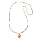 Flat lay of the Step Into Self White Opal Mandala Mala displayed neatly, emphasizing the 108 white opal and turquoise beads along with the mandala pendant, perfect for those seeking a connection to spiritual meaning and manifestation.