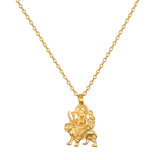 A gold-toned necklace with a fine cable chain and a pendant of a multi-armed figure seated on a tiger.