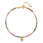 The First Step Tourmaline Lotus Anklet beautifully showcases colorful multi tourmaline beads with a golden lotus flower pendant. This piece embodies spiritual jewelry for meditation and serves as a meaningful talisman for abundance and new beginnings, ideal for those on their manifestation journey.