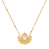 Majestic Light Moonstone Necklace showcased beautifully, featuring a teardrop-shaped moonstone set in a golden cornice, representing spiritual jewelry, meditation, and protection for your journey.