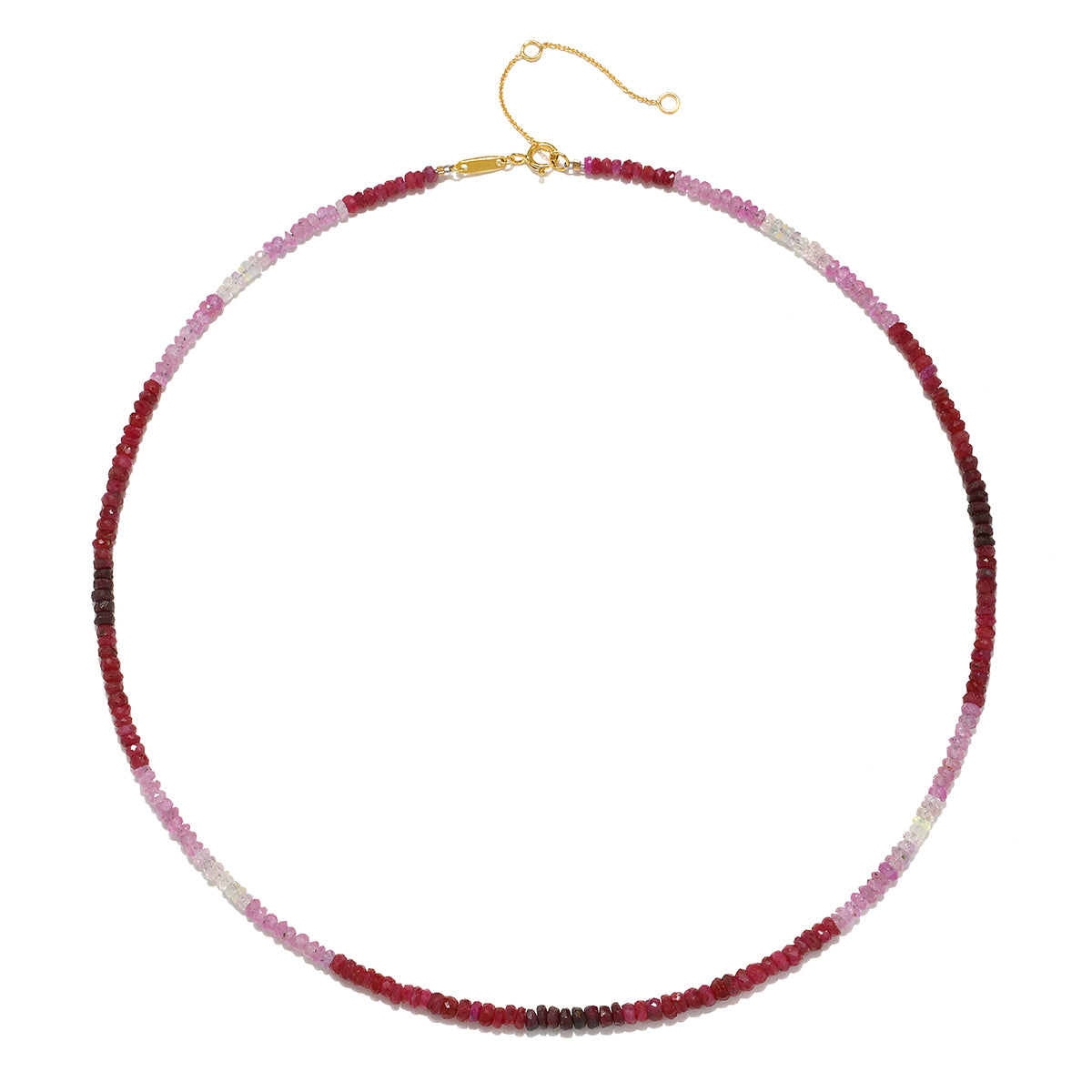 Flat lay of the Shades of Passion 14kt Gold Ruby Necklace showcasing its stunning ombré ruby shades against a light background, illustrating its meaning and significance in spiritual jewelry and meditation.