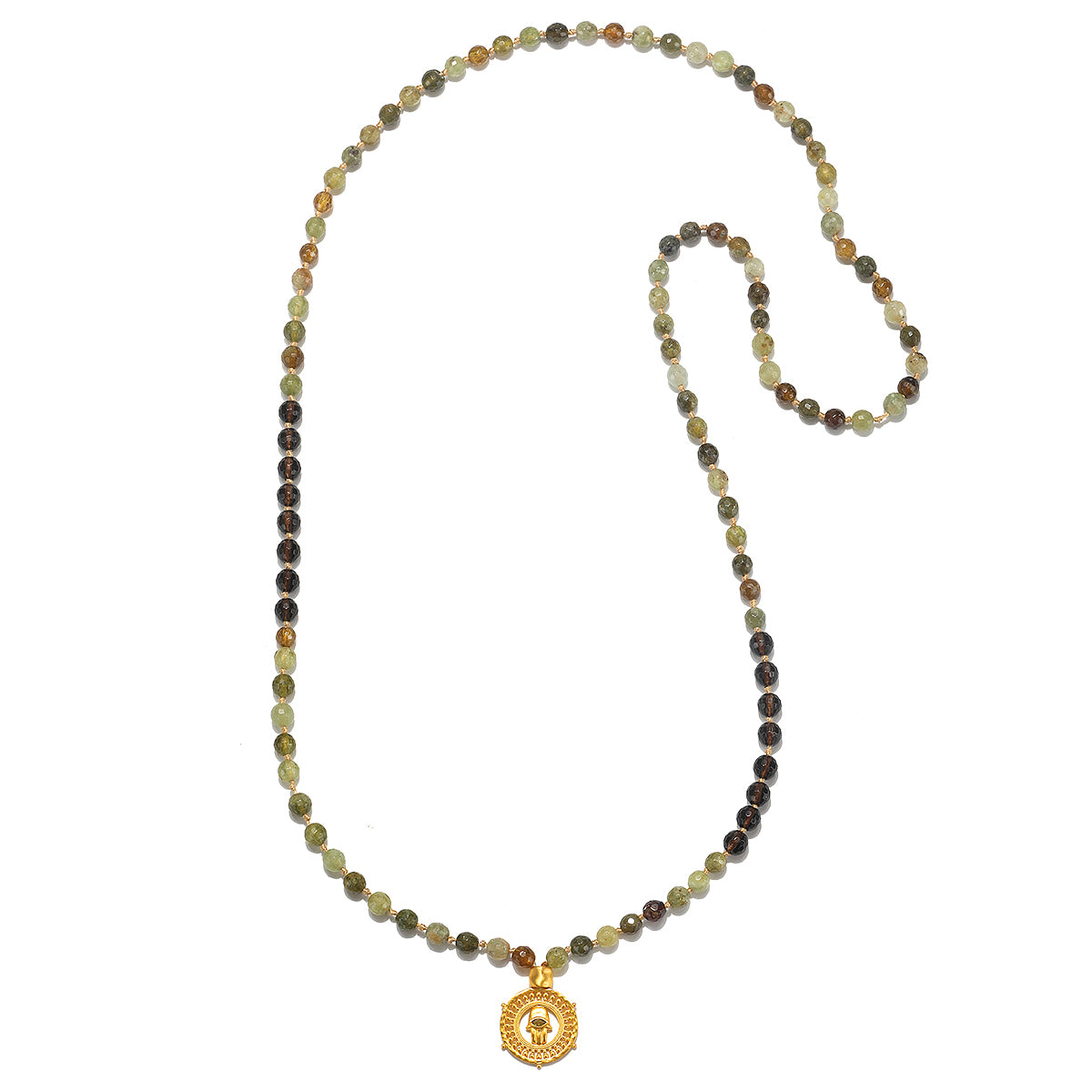 The Inhabit Your Power Smokey Quartz Green Garnet Mala elegantly displayed on a flat surface, highlighting its vibrant smokey quartz and green garnet beads. This mala is a beautiful piece of spiritual jewelry, ideal for meditation and personal manifestation, and a perfect talisman for connecting with the sun and moon.