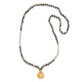 Beacon of Creativity Fancy Jasper Celestial Mala, featuring hand-beaded 108 fancy jasper beads, a golden coin pendant engraved with the sun and moon, ideal for spiritual jewelry, meditation, and manifestation practices. This meaningful mala serves as a talisman for creativity and grounding, perfect for yoga enthusiasts.