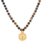 Enduring Strength Tiger Eye Hamsa Mala featuring a beautiful arrangement of tiger eye and black onyx beads with a golden hamsa coin, perfect for spiritual jewelry and meditation practices, symbolizing protection and manifestation.