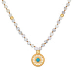 Step Into Self White Opal Mandala Mala featuring 108 white opal beads and an 18kt gold plated mandala pendant with turquoise, ideal for spiritual jewelry and meditation practices. This talisman embodies the meaning of protection and manifestation, perfect for yoga enthusiasts.