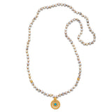 Step Into Self White Opal Mandala Mala featuring 108 white opal beads and an 18kt gold plated mandala pendant with turquoise. This beautiful piece of spiritual jewelry is perfect for meditation and serves as a meaningful talisman for protection and manifestation. Ideal for yoga enthusiasts and those seeking clarity and balance in their spiritual journey.