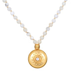 Tranquil Dawn White Opal Sun Mala featuring a golden sun pendant and white opal beads, perfect for meditation and yoga practices. This spiritual jewelry serves as a meaningful talisman for manifestation, combining the energies of the sun and moon, ideal for protection and connecting with zodiac energies.