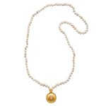 The Tranquil Dawn White Opal Sun Mala laid flat, showing off the elegant arrangement of white opal beads and the golden sun pendant, connecting to themes of spirituality, protection, and meaningful talisman wear.