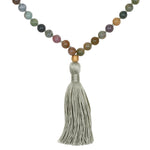 Grounding Fancy Jasper Gemstone Mala featuring 108 smooth round beads, a gold lotus bead, and a hand-tied silk tassel. This spiritual jewelry enhances meditation, serves as a talisman for grounding and focus, and symbolizes new beginnings in the practice of yoga and manifestation.
