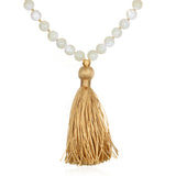 Wisdom Lotus Pearl Gemstone Mala with a golden tassel, perfect for spiritual jewelry and meditation, serving as a talisman for protection and manifestation, symbolizing the sun and moon and enhancing your yoga practice.
