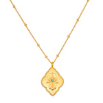 Close-up of the hamsa pendant from the Intention of Blessings Necklace Set, showcasing intricate details in 18kt gold plate. This spiritual jewelry is designed as a talisman for protection and manifestation, making it ideal for your yoga and meditation practices.
