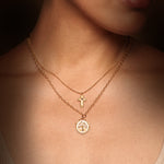 Layered Unwavering Faith Garnet Cross Necklace showcasing a delicate cross and a meaningful pendant, ideal for those seeking spiritual jewelry that resonates with zodiac signs and talismans for positivity and guidance.