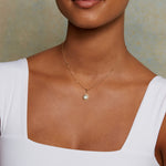 Model wearing the North Star Blue Topaz Starburst Necklace, showcasing its elegant design that combines beauty and meaning in spiritual jewelry, ideal for zodiac enthusiasts and yoga practitioners.