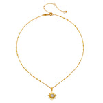 Gold chain necklace with starburst pendant featuring white topaz center stone and lobster clasp.
