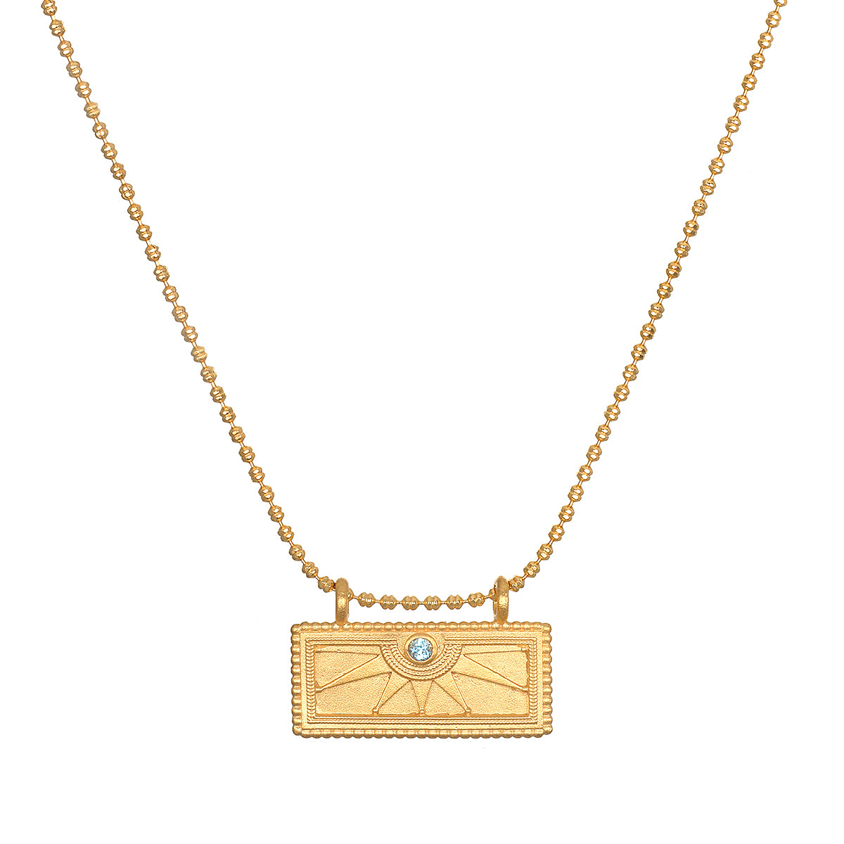 March Aquamarine Sunburst Birthstone Tablet Necklace elegantly displayed, featuring an 18kt gold plated tablet with a sunburst engraving and aquamarine accent. This piece embodies spiritual jewelry and serves as a meaningful talisman for meditation and manifestation, connecting to the energies of the sun and zodiac.
