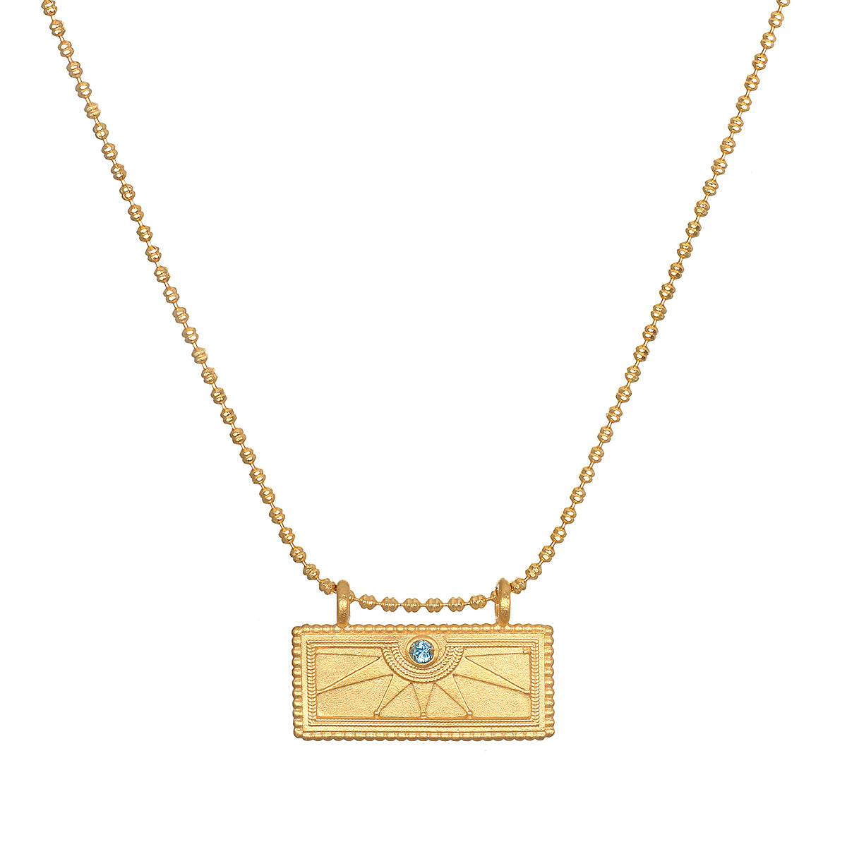 December Blue Topaz Sunburst Birthstone Tablet Necklace featuring a radiant sunburst design, perfect for spiritual jewelry enthusiasts. This meaningful piece embodies qualities of communication, wisdom, and love, ideal for meditation and manifestation practices. It serves as a talisman representing the vibrant energies of the sun, making it a beautiful charm for yoga and zodiac enthusiasts.