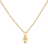 Guiding Hand Mini Hamsa Necklace featuring an 18kt gold plated pendant, ideal for spiritual jewelry and meditation. This talisman promotes protection and embodies meaningful qualities associated with zodiac signs. Perfect for yoga practitioners and those focused on manifestation, this necklace is a charming addition to any collection.