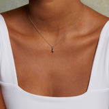 Mini Hamsa Diamond 14kt Gold Pendant Necklace elegantly worn, emphasizing its significance as a charm for spiritual growth and protection. This necklace is perfect for meditation, astrology enthusiasts, and anyone looking for a meaningful talisman.