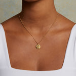 Close-up of the Sacred Realm Spinning Pendant Celestial Necklace highlighting the sun and moon motif, a beautiful piece of spiritual jewelry and talisman for those seeking vitality and inspiration.