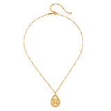 Open to Possibilities Lotus Necklace displayed elegantly, showcasing its intricate teardrop pendant with a lotus flower design. This piece of spiritual jewelry is perfect for meditation and serves as a meaningful charm for those who practice yoga and seek protection and connection to their zodiac signs.