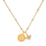 Manifesting Possibilities Lotus White Topaz Necklace featuring an elegant beaded medallion and lotus flower charm in 18kt gold plating, symbolizing new beginnings and creativity. Ideal for spiritual jewelry enthusiasts and those passionate about meditation, talismans, and meaningful charms.