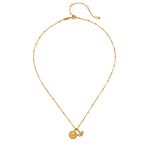 Flat lay of the Manifesting Possibilities Lotus White Topaz Necklace, emphasizing its intricate design and gold plating. This necklace serves as a meaningful charm that harmonizes with yoga and spiritual practices, embodying the themes of new beginnings and manifestation.