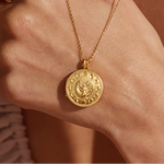 Close-up of the Mother Moon Gold Locket Necklace worn by a model, highlighting its charm and significance in spiritual practices, ideal for those interested in spirituality, talismans, and zodiac meanings.