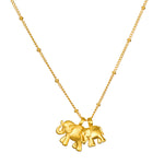 The Elephant Love Gold Necklace features two elegant 18kt gold plate elephants, symbolizing strength and wisdom. This meaningful piece embodies spiritual jewelry and serves as a talisman for good fortune and protection, perfect for meditation and yoga enthusiasts. Enjoy the charm of this necklace as a reminder of love and manifestation.