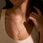 Close-up of a woman wearing the Guiding Faith Star of David Necklace layered with another piece, celebrating the beauty of spiritual jewelry. This elegant design is a meaningful talisman that embodies protection, perfect for yoga and meditation practices.