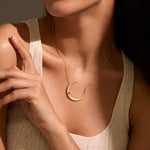 Model wearing the Eternal Guidance Moon Necklace, showcasing its elegant design on a relaxed shirt. This spiritual jewelry serves as a powerful talisman, embodying the moon's energy and meaning, ideal for those seeking protection and guidance during meditation and yoga.