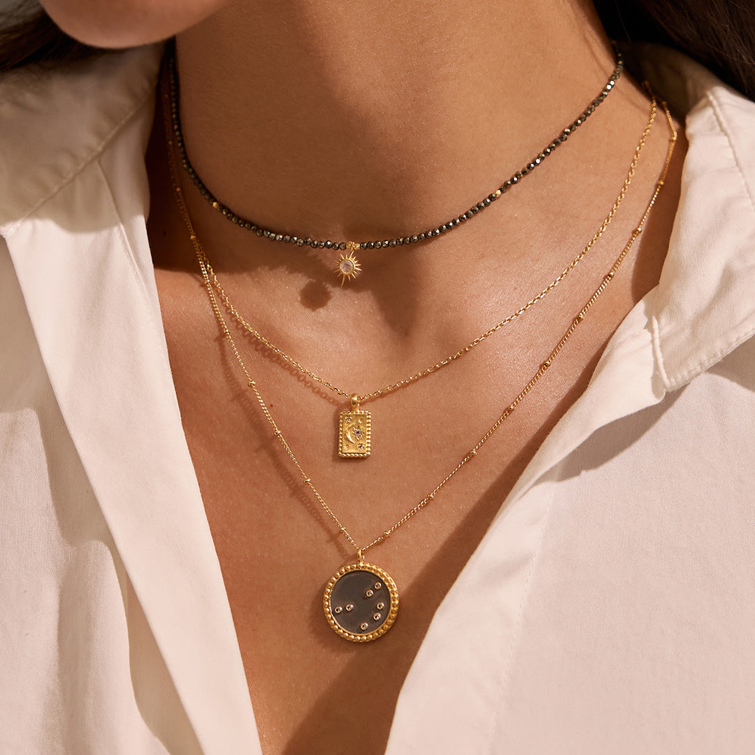 Close-up of the Magic in Moonlight Necklace being worn, highlighting the intricate design of the crescent moon and star, making it a beautiful talisman and piece of spiritual jewelry for meditation and personal transformation.