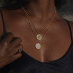 A close-up of the Shine in Sisterhood Constellation Necklace worn beautifully, highlighting its gold plating and intricate design. This necklace serves as a talisman for meaningful reflection and prosperity, a perfect addition to your spiritual jewelry collection for yoga and meditation.