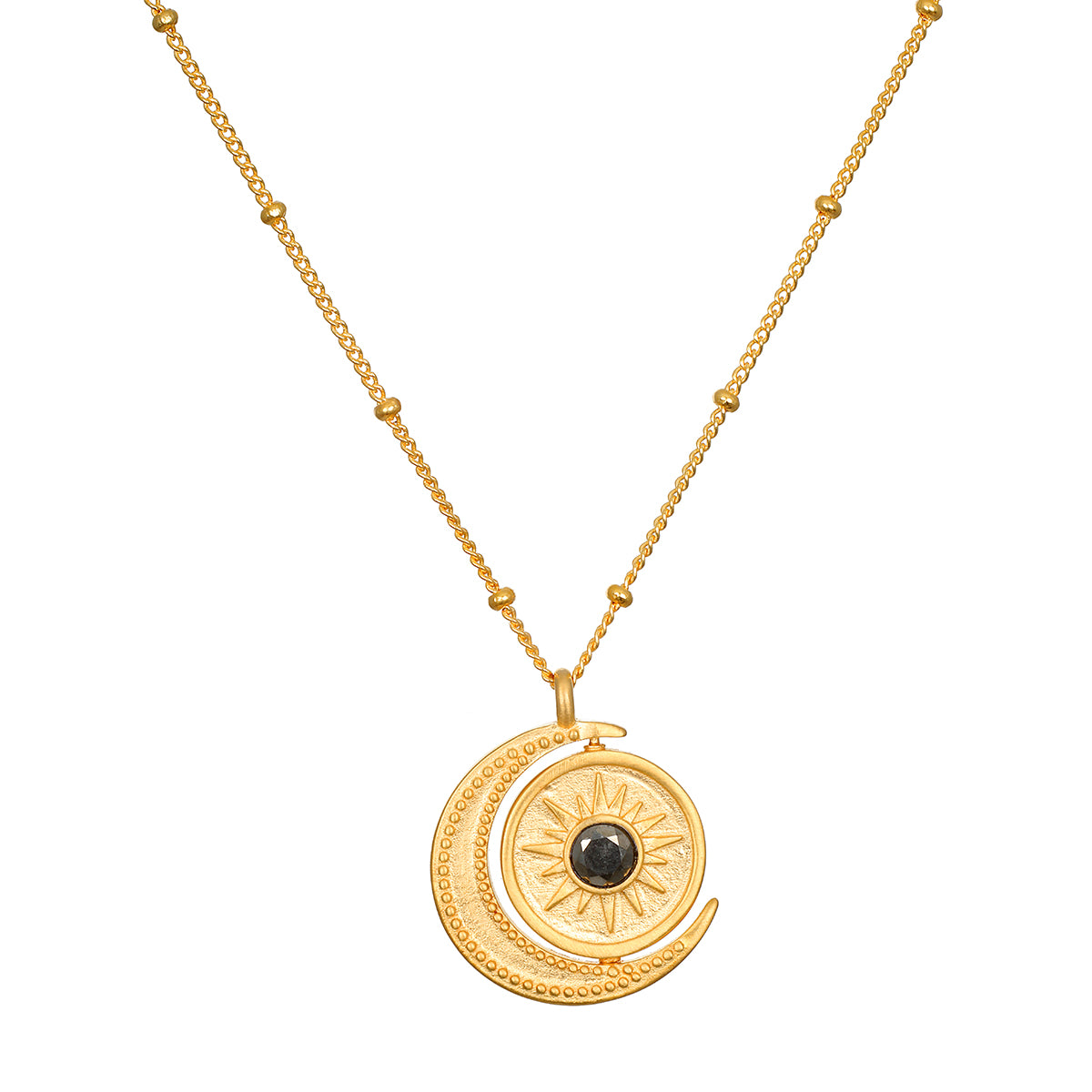 Detailed view of the United in Light Spinning Pendant Necklace featuring the sun and moon design, crafted from 18kt gold plating. This meaningful talisman is an exceptional piece of spiritual jewelry, perfect for manifestation, meditation, and enhancing one's connection to the zodiac and yoga.