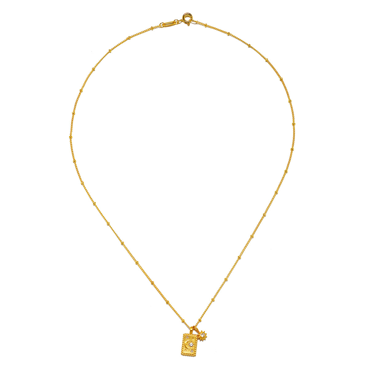 Magic in Moonlight Necklace displayed elegantly, showcasing its exquisite design with 18kt gold plating, ideal for yoga practitioners seeking meaningful spiritual jewelry that embodies the essence of the sun and moon.