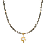Dreams of Prosperity Pyrite Necklace featuring gleaming pyrite beads and a golden starburst moonstone pendant. This spiritual jewelry embodies the essence of prosperity and clarity, perfect for meditation or yoga practices. A meaningful talisman for manifestation and protection, this necklace resonates with the energies of the sun and moon, making it a great piece for zodiac enthusiasts.