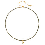 Dreams of Prosperity Pyrite Necklace featuring gleaming pyrite beads and a golden starburst moonstone pendant. This spiritual jewelry embodies the essence of prosperity and clarity, perfect for meditation or yoga practices. A meaningful talisman for manifestation and protection, this necklace resonates with the energies of the sun and moon, making it a great piece for zodiac enthusiasts.