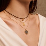 Model showcasing the Magic in Moonlight Necklace layered with other necklaces, emphasizing its celestial charm and suitability as spiritual jewelry for those interested in zodiac meanings and talismans.
