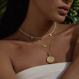 The Renewed Hope Pearl Butterfly Necklace layered with other necklaces, creating a stylish and meaningful look. This combination serves as spiritual jewelry, ideal for those who find meaning in meditation, embrace the transformative nature of hope, and seek protection through their accessories while connecting with the zodiac.