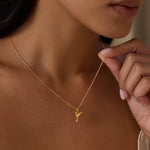 A close-up of the Loving Devotion Hummingbird Necklace being held by a model, highlighting its beautiful design and the meaningful presence it brings as a talisman for protection and spiritual connection.