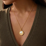 The Take Flight Butterfly Pearl Locket Necklace elegantly displayed on a model, symbolizing transformation and new beginnings. This piece of spiritual jewelry is perfect for meditation and serves as a meaningful talisman for protection and manifestation.