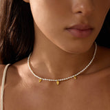 Close-up of the Blooming Promise Lotus Pearl Necklace worn, showcasing its elegant design with gold lotus petals, ideal for spiritual jewelry and meaningful adornment that resonates with themes of transformation and zodiac energy.