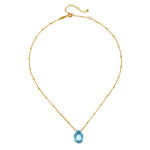 Sleek presentation of the Blessed Abundance Blue Topaz Necklace highlighting the 18kt gold plated design, an enchanting piece for spiritual growth and manifestation.