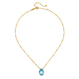 Sleek presentation of the Blessed Abundance Blue Topaz Necklace highlighting the 18kt gold plated design, an enchanting piece for spiritual growth and manifestation.