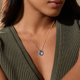 Close-up view of a woman wearing the Blessed Abundance Blue Topaz Necklace, embodying elegance in spiritual jewelry while enhancing communication and meaningful connections.